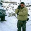 Tajikistan-Hunter-Calling-home-on-his-satellite-phone